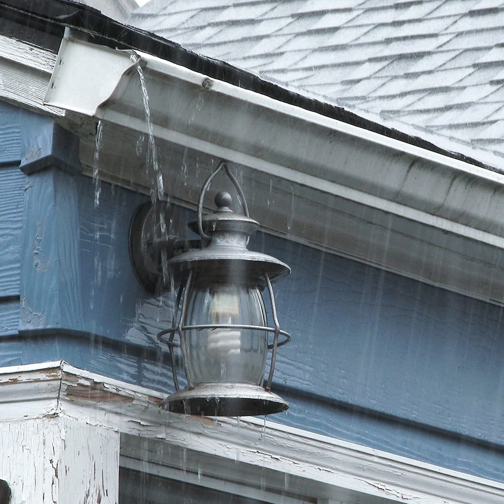 Gutters showing heavy rain fall overflowing